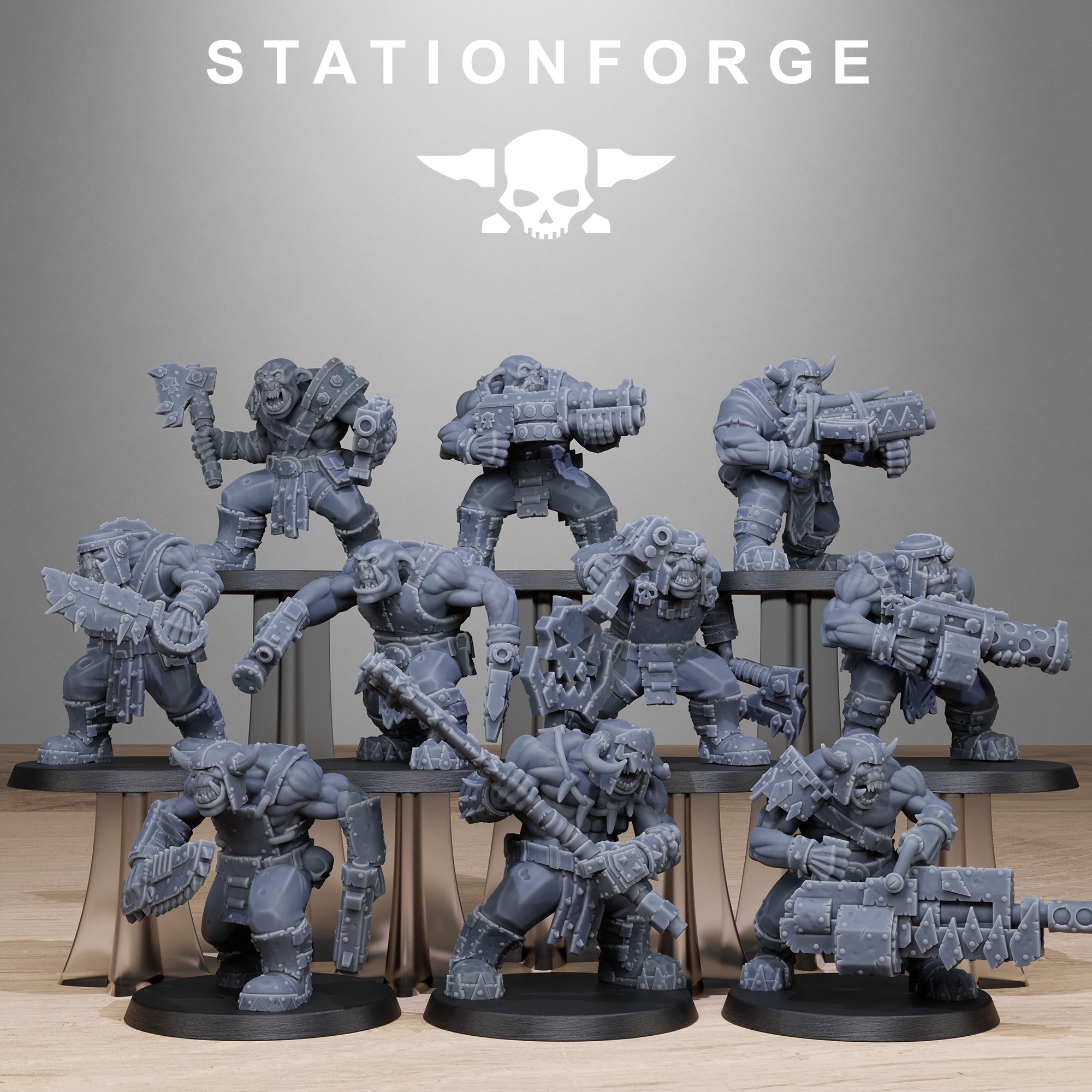 Collection of gray miniature figures on a stand with 'Stationforge' branding. Used for war gaming 