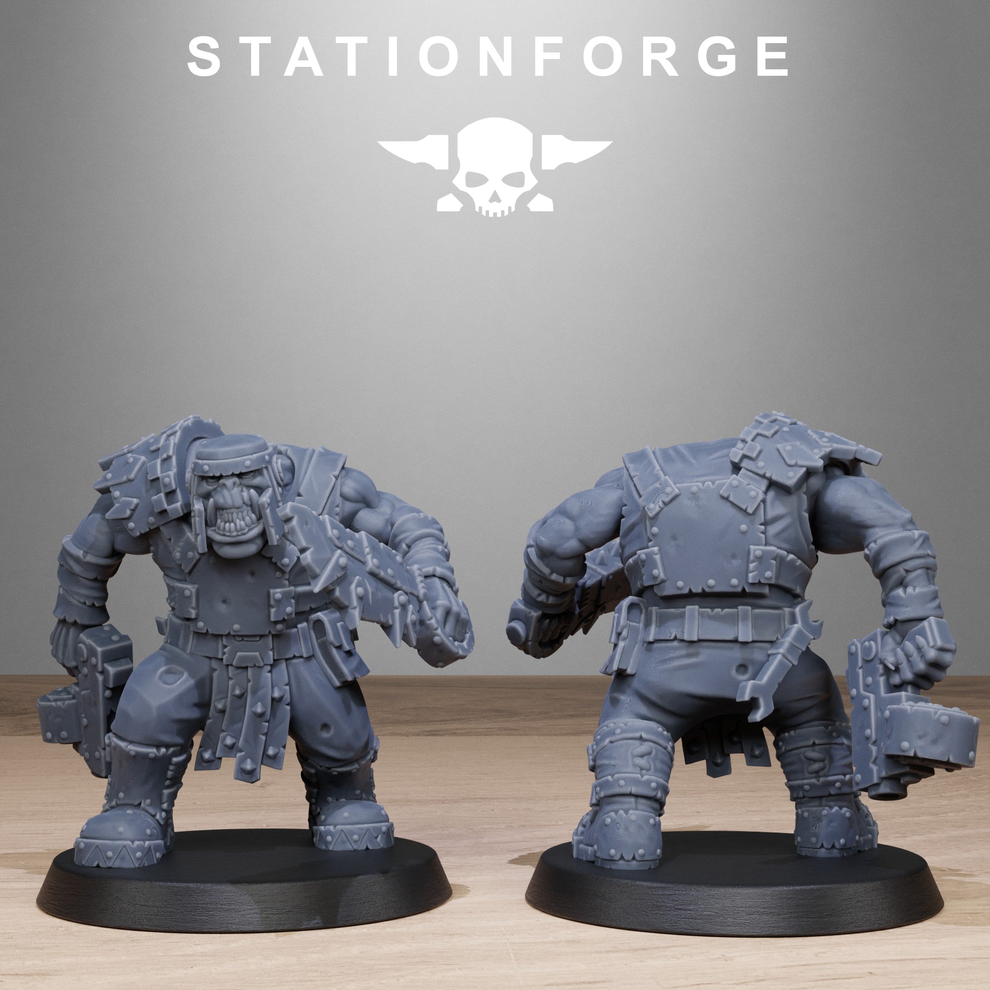Two gray miniature figures on black bases with 'Stationforge' logo above.