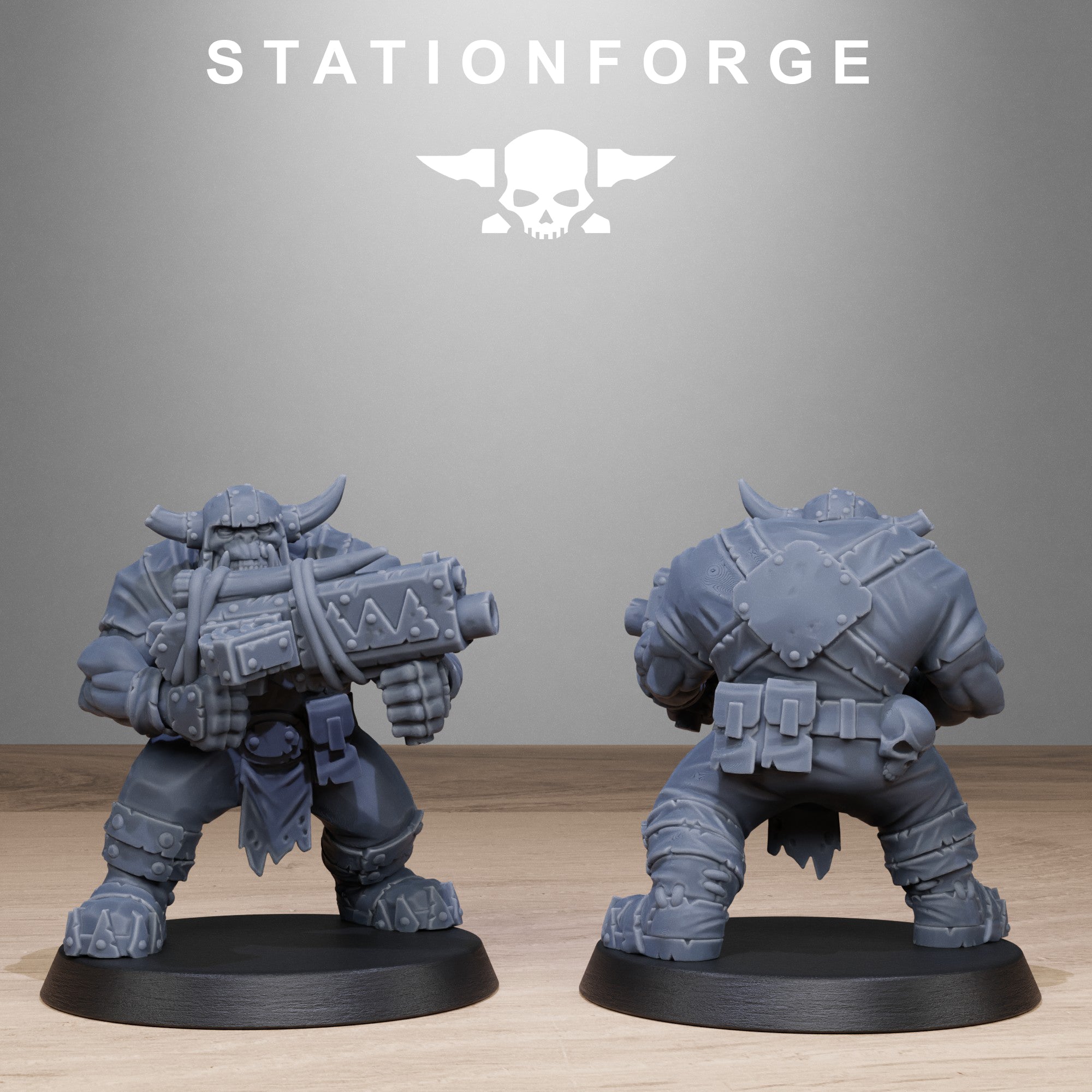 Two gray miniature figures on black bases with 'Stationforge' branding in the background.