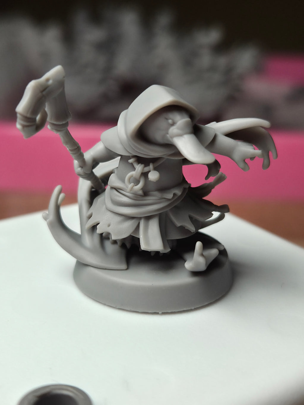 Printed sample photo of Platypus Tidebinder resin miniature showing real-world 16K print quality detail for D&D and tabletop RPG gaming.