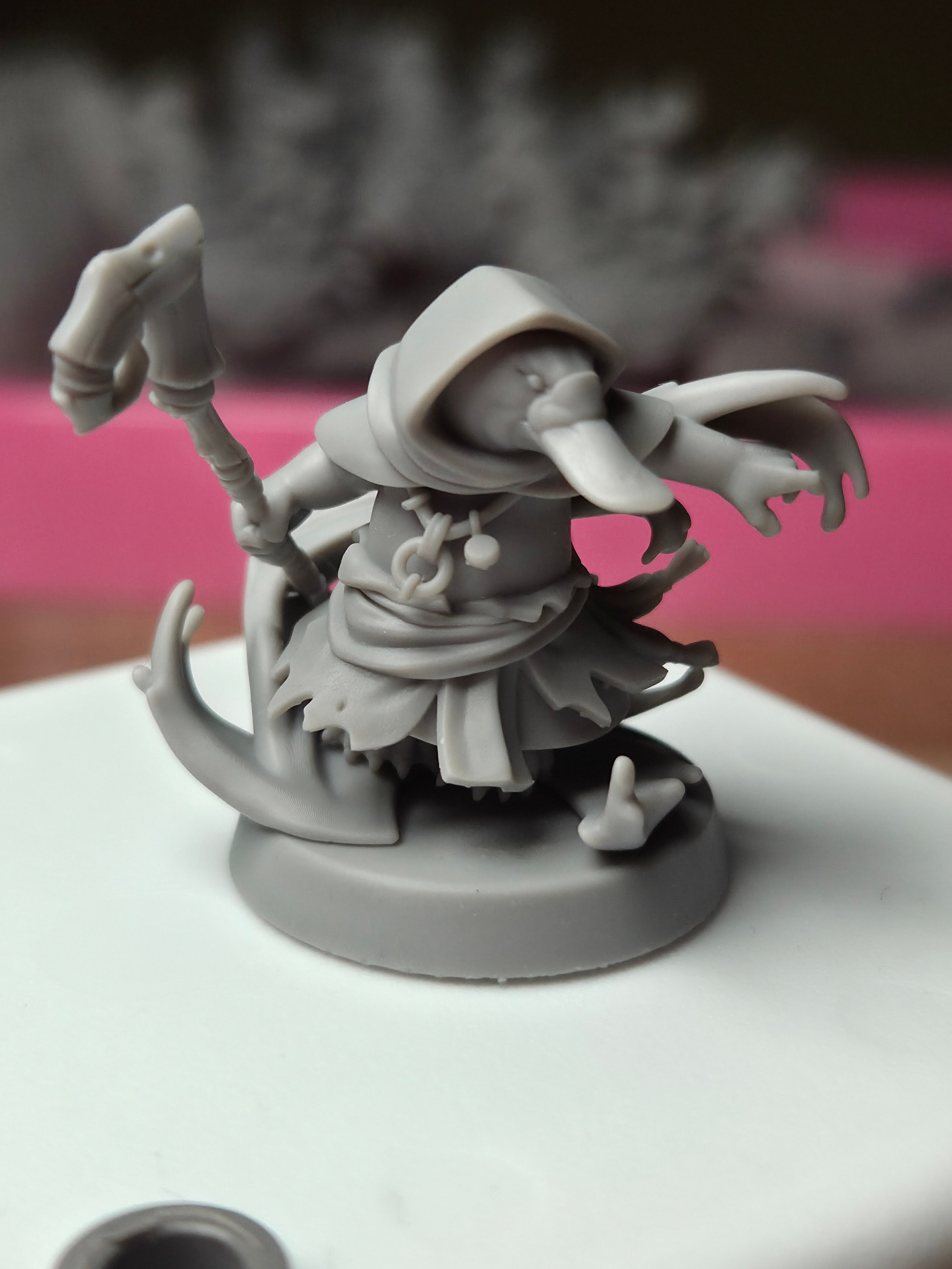 Printed sample photo of Platypus Tidebinder resin miniature showing real-world 16K print quality detail for D&D and tabletop RPG gaming.
