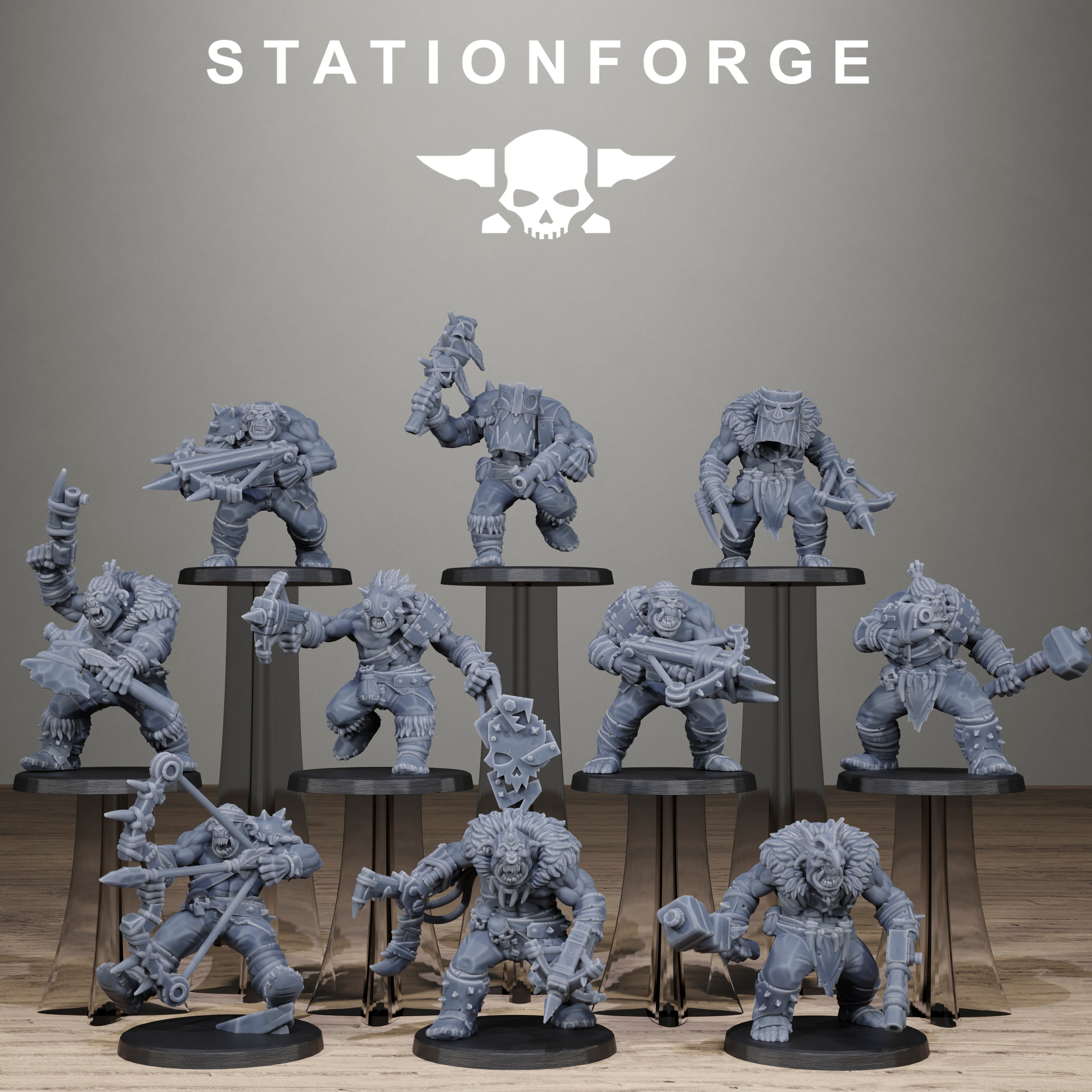 Collection of gray miniature figures on stands with 'Stationforge' logo above.