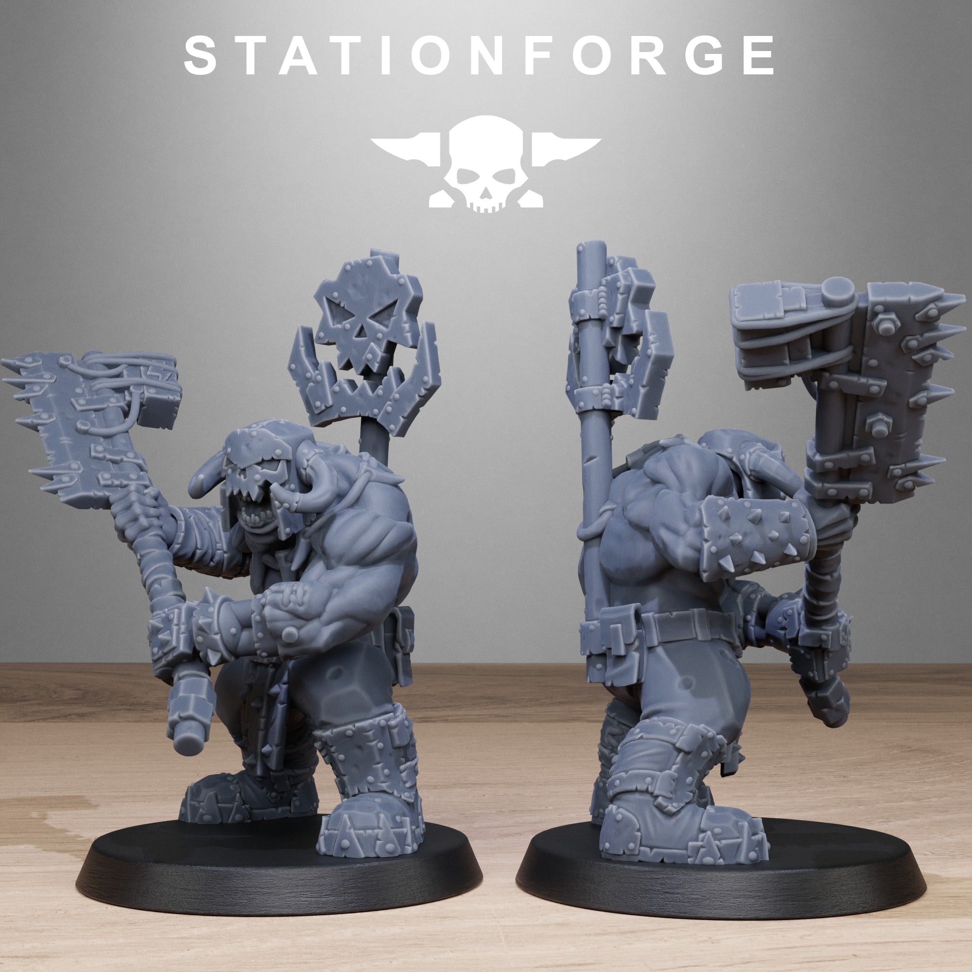 Two gray warrior figurines with large weapons on black bases against a gray background with 'Stationforge' branding.