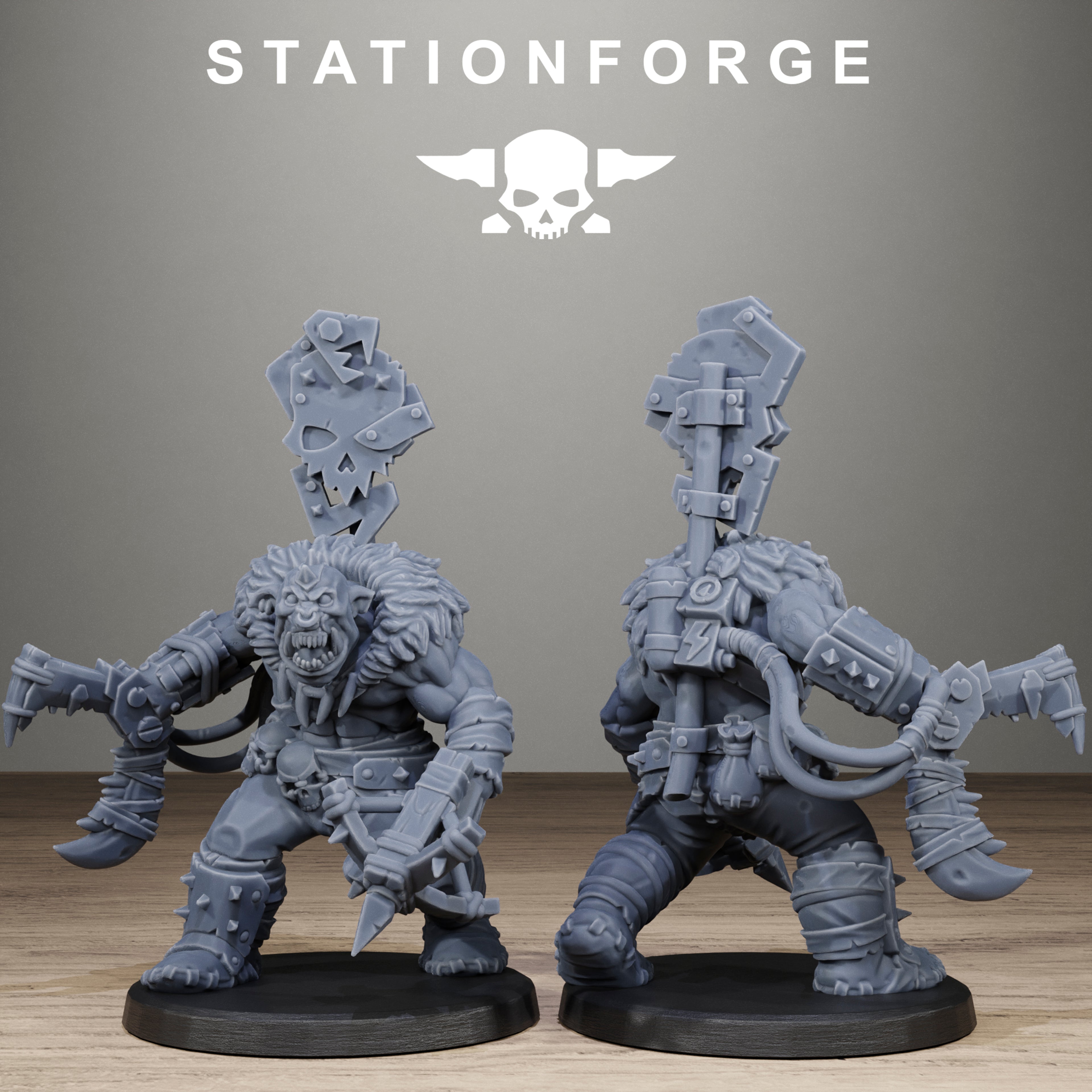 Two gray fantasy figurines on a wooden surface with 'Stationforge' branding above.
