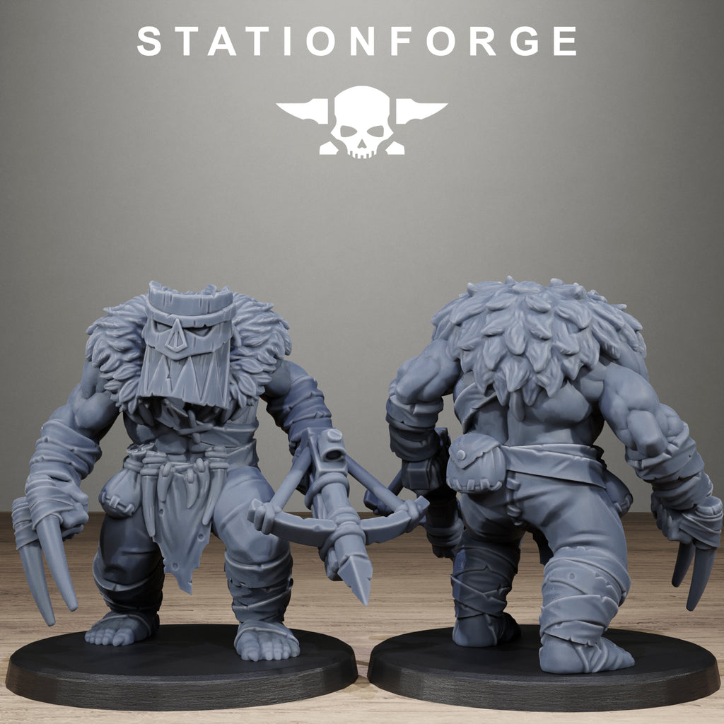 Two gray fantasy figurines on black bases with 'Stationforge' logo in the background.