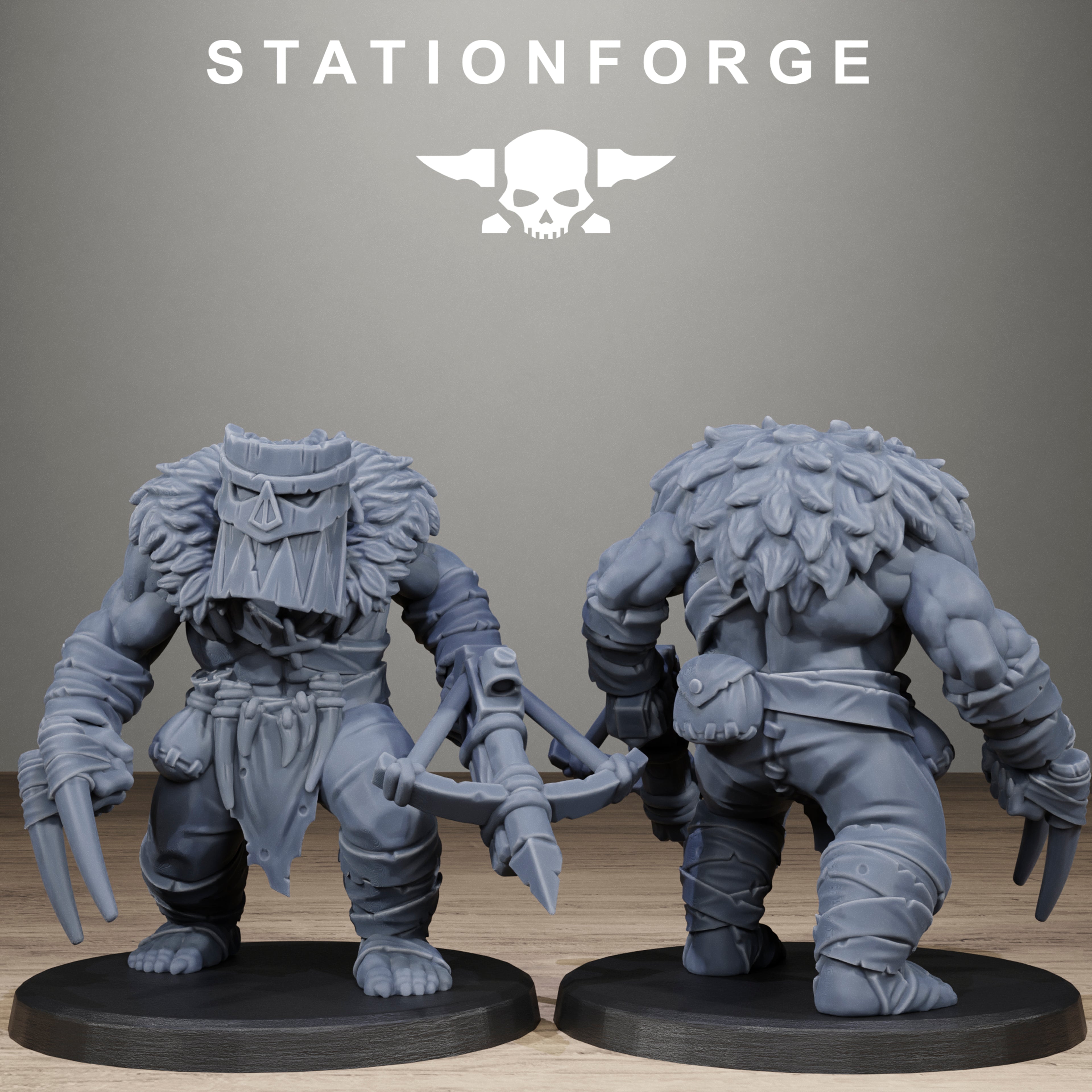 Two gray fantasy figurines on black bases with 'Stationforge' logo in the background.