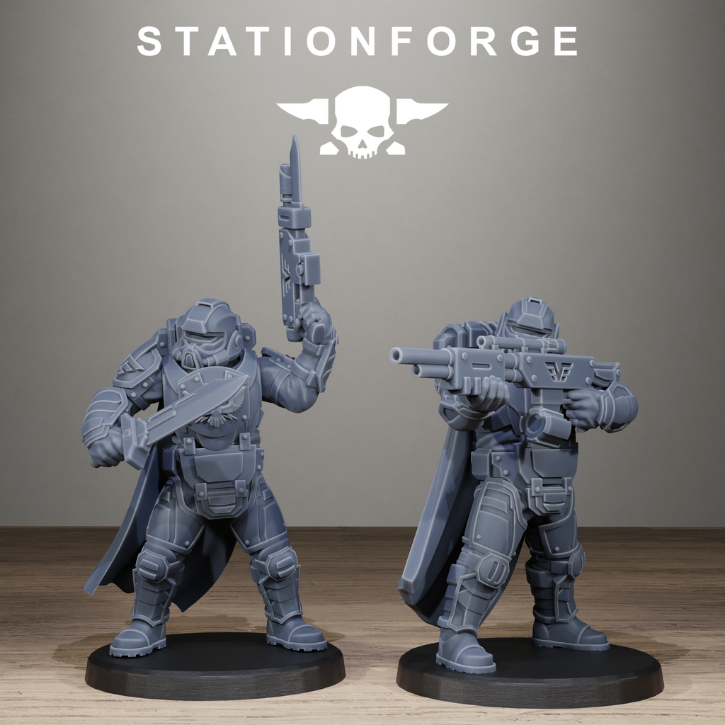 Two gray warrior figurines on black bases with 'Stationforge' logo in the background.