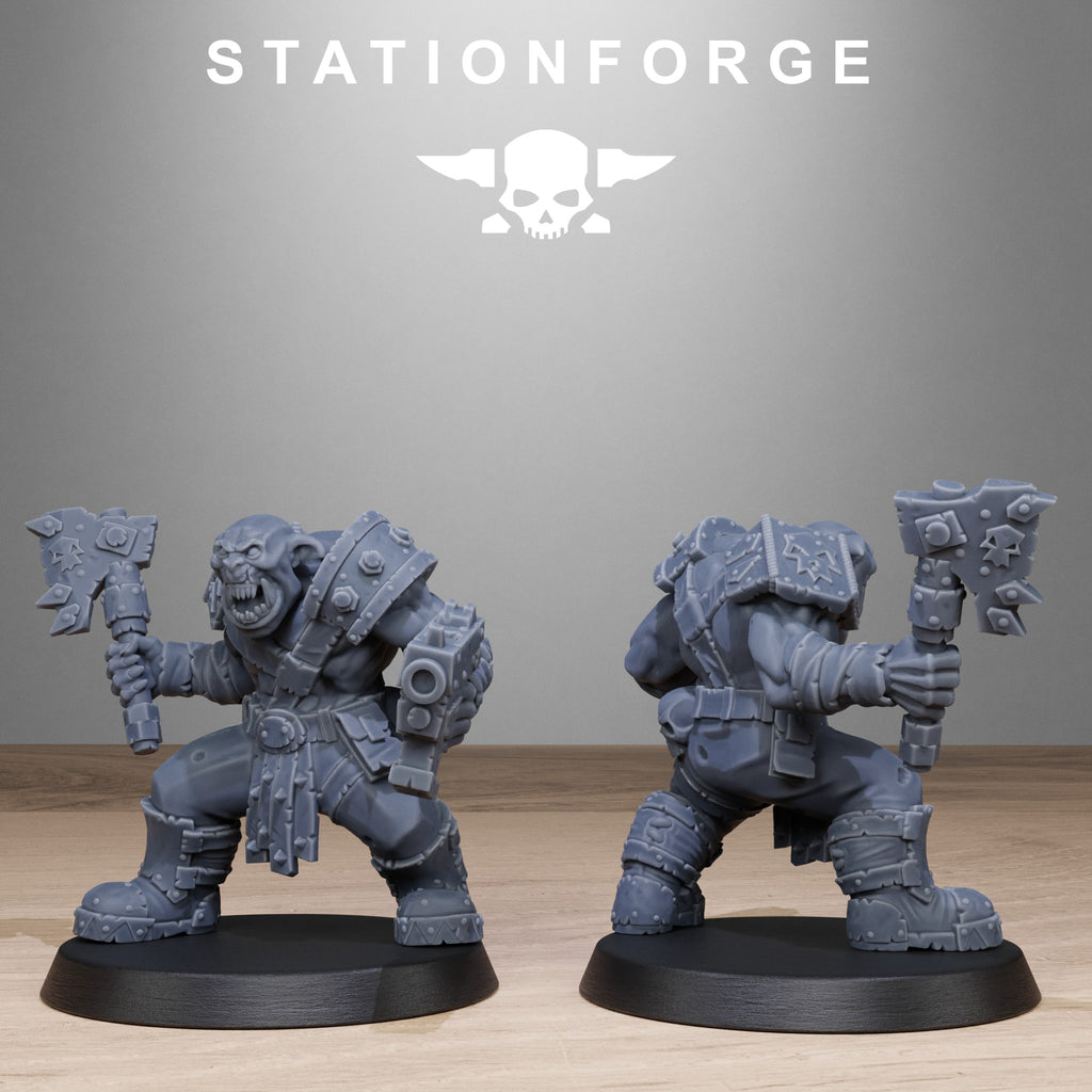 Two warrior figurines with axes on black bases against a gray background with 'Stationforge' branding.