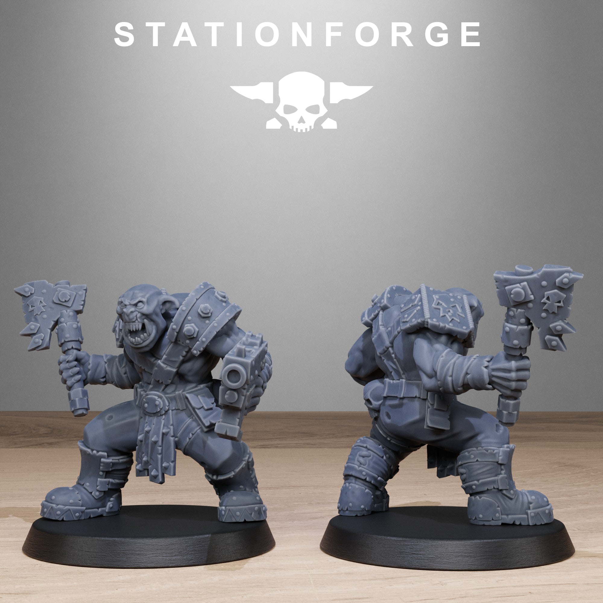 Two warrior figurines with axes on black bases against a gray background with 'Stationforge' branding.