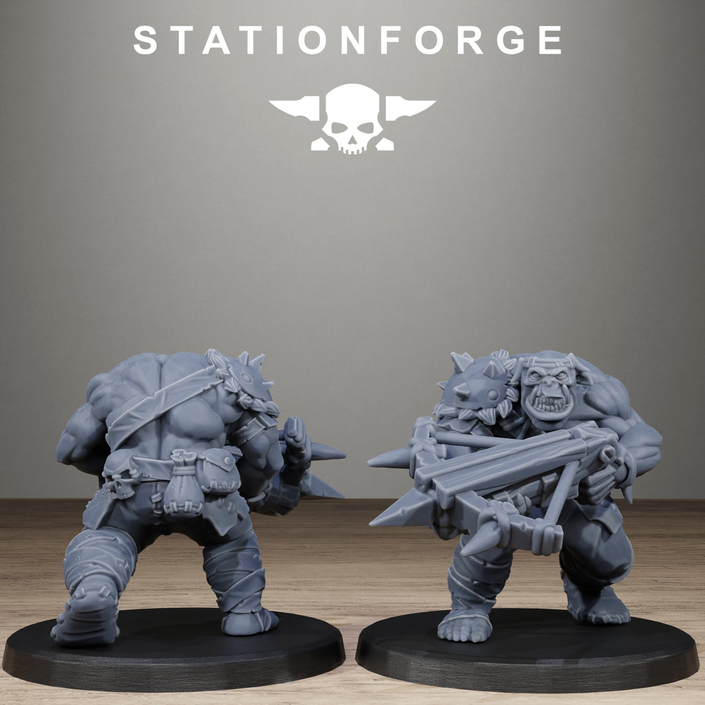 Two gray miniature figures on black bases with Stationforge logo above.