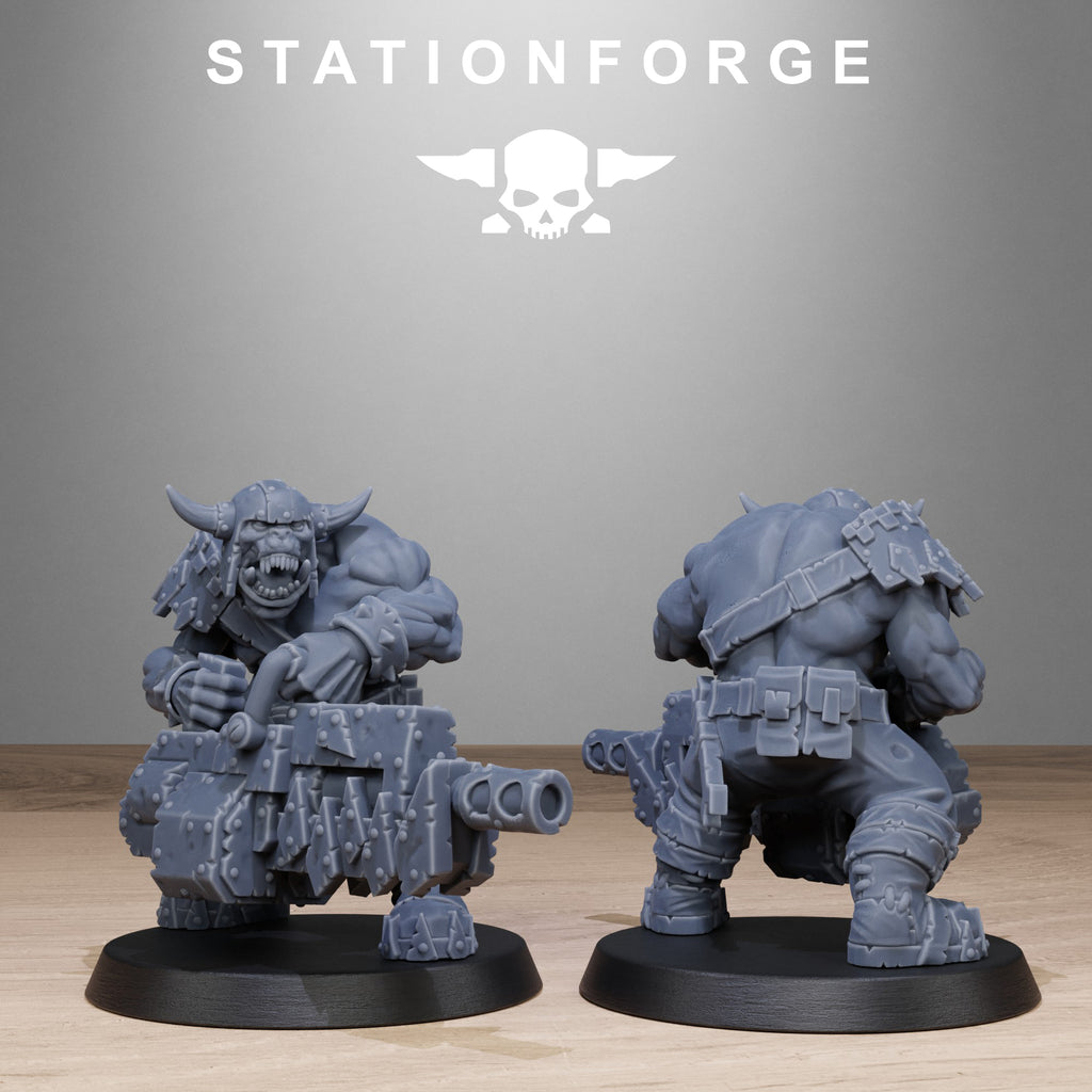 Two gray miniature figures on black bases with 'Stationforge' branding above.