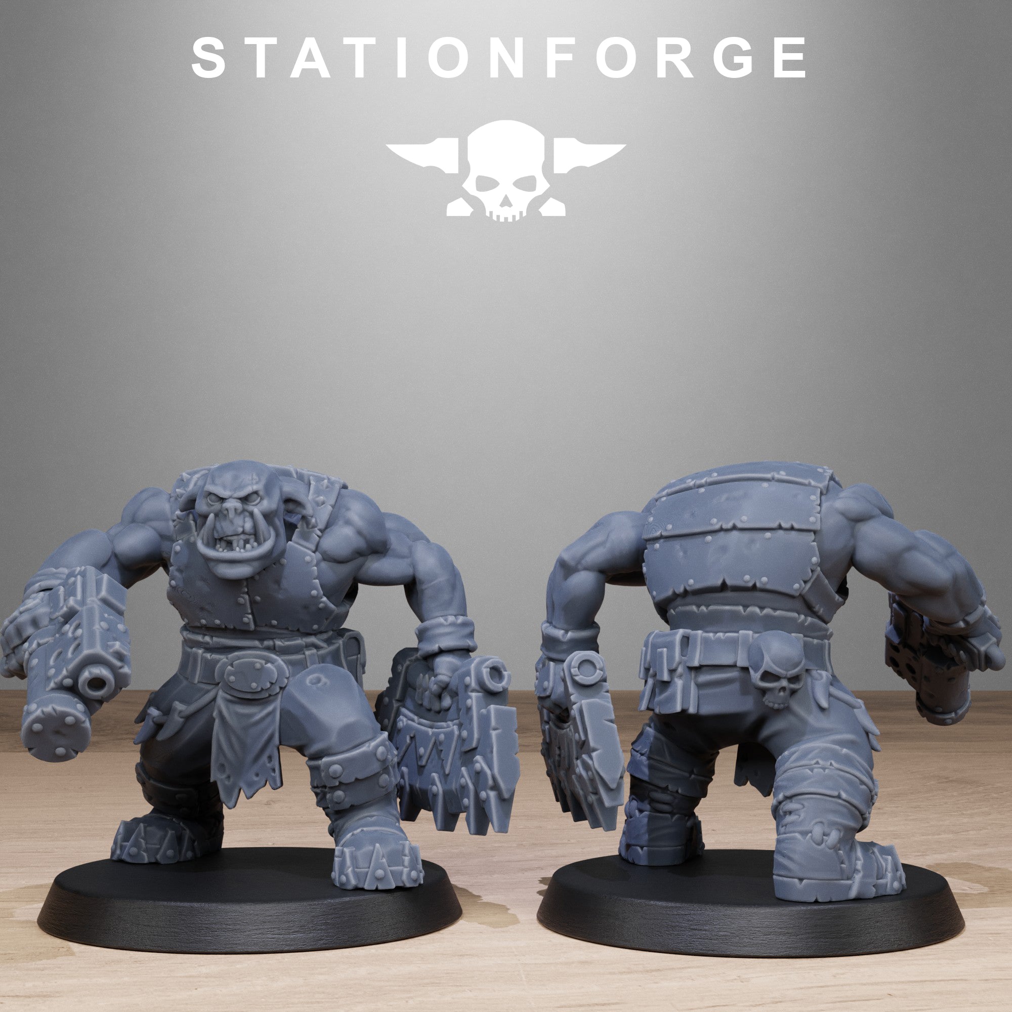 Two gray fantasy figurines on black bases with 'Stationforge' logo above.