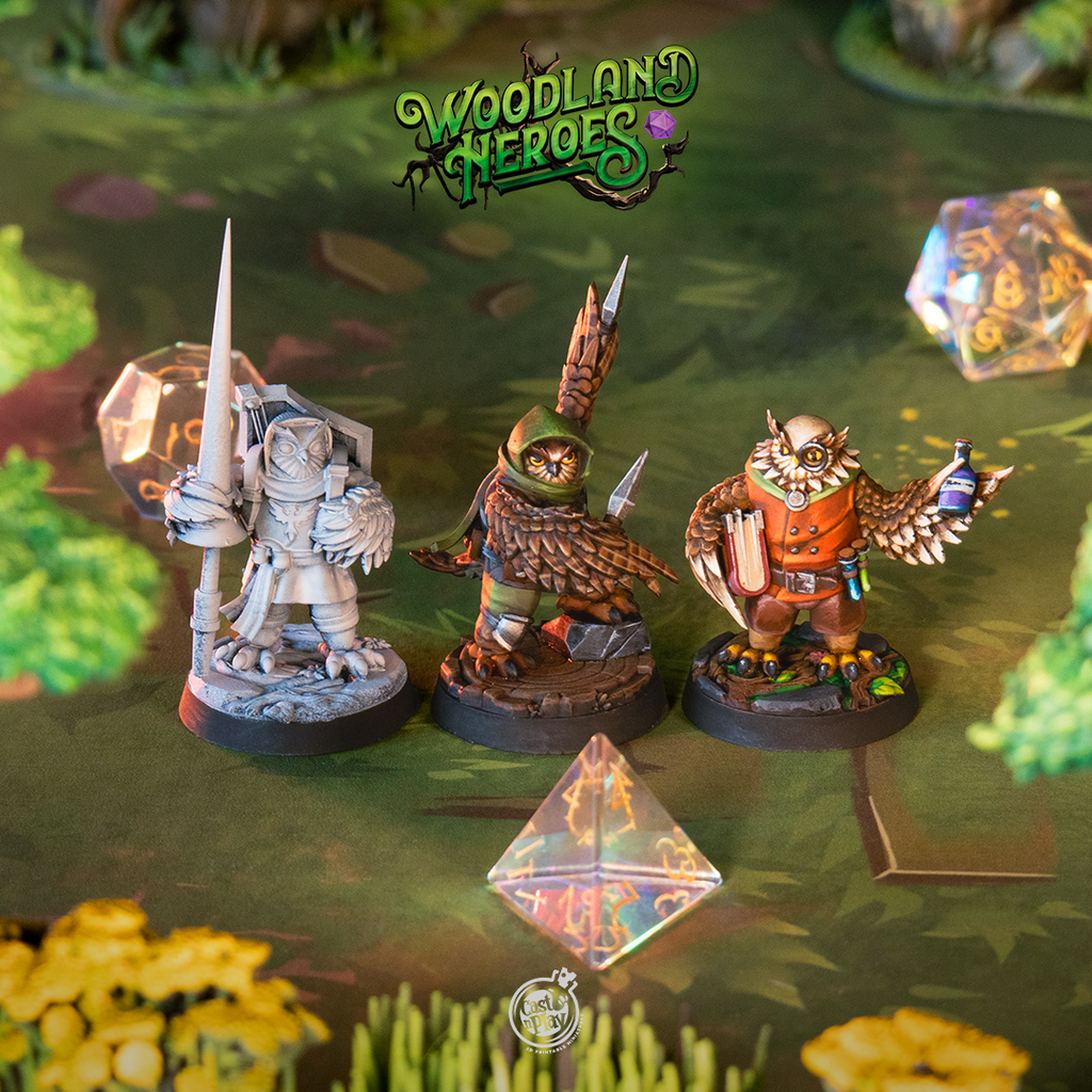Painted Owlfolk miniatures displayed on a woodland battle map with dice, showcasing three Owlin character sculpts for D&D 5e, Pathfinder, and Humblewood tabletop RPG campaigns.
