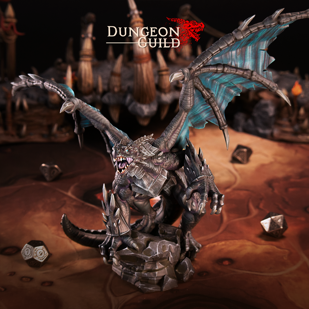 Painted resin Ivoran Obsidian Dragon miniature for D&D and tabletop RPG, displayed in dark metallic tones with glowing teal wing membranes on a gaming table with dice for scale.